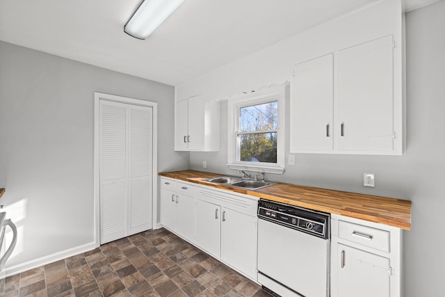 kitchen with butcher block countertops, white dishwasher, sink, and white cabinetry