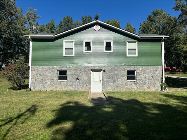 back of property with a yard