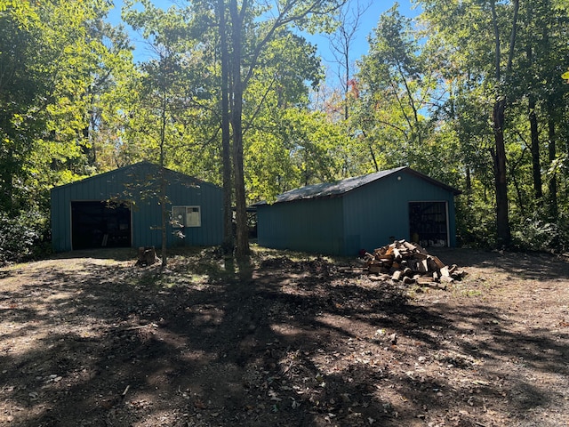 exterior space featuring an outdoor structure and a garage