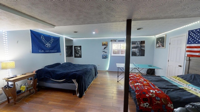 bedroom with hardwood / wood-style flooring