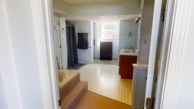 bathroom with vanity and separate shower and tub