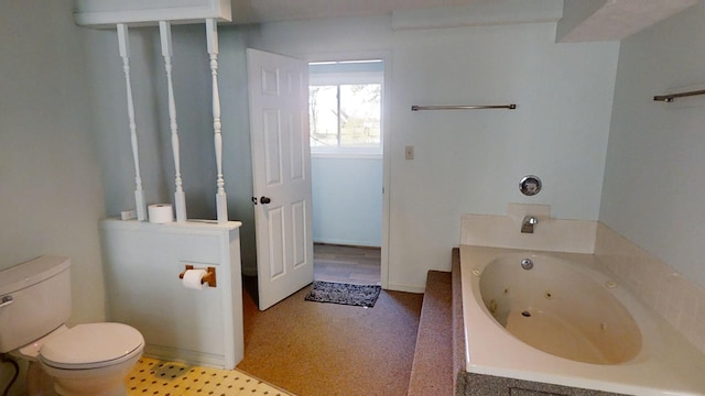 bathroom featuring toilet and a bath