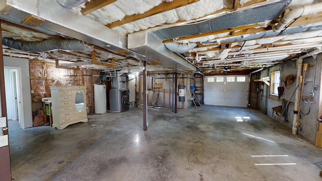 basement with heating unit, water heater, and gas water heater