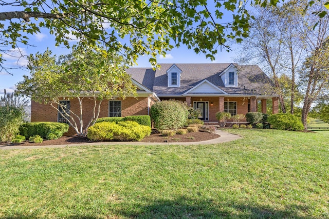 cape cod home with a porch and a front yard