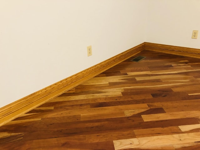 interior details featuring hardwood / wood-style floors