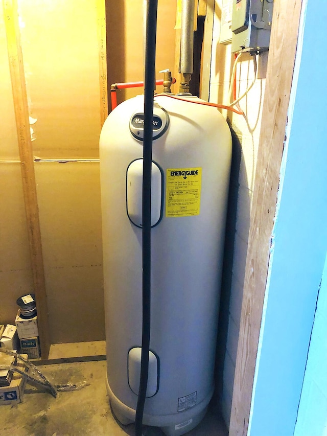 utility room featuring water heater