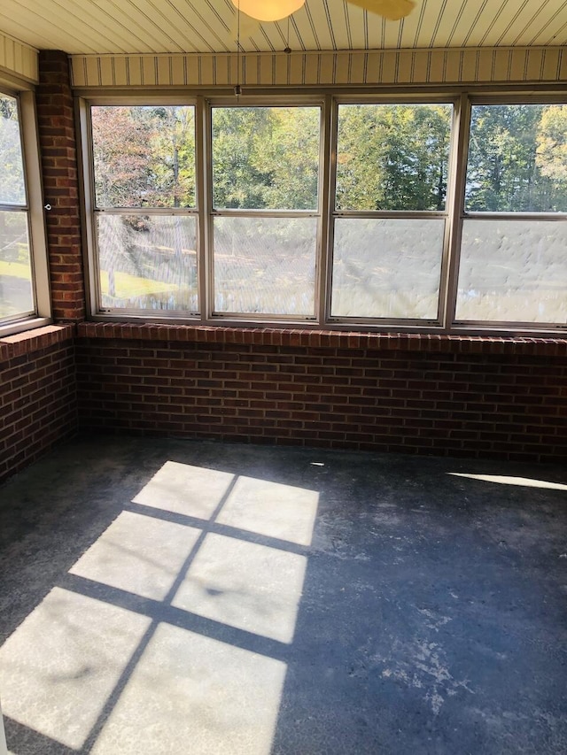 unfurnished sunroom with plenty of natural light