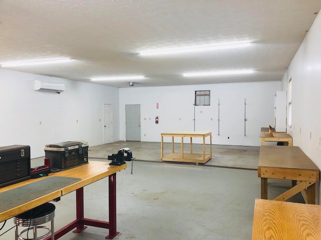 basement with a wall mounted air conditioner