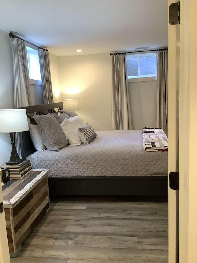 bedroom with hardwood / wood-style flooring