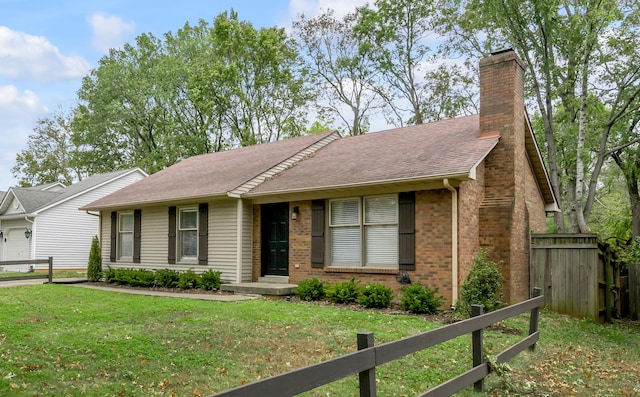 ranch-style home with a front lawn