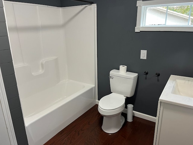 full bathroom with vanity, toilet, shower / washtub combination, and hardwood / wood-style floors