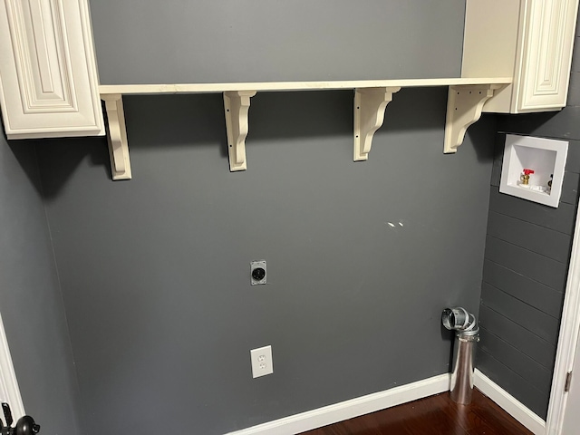 washroom with dark wood-type flooring, baseboards, hookup for a washing machine, cabinet space, and electric dryer hookup