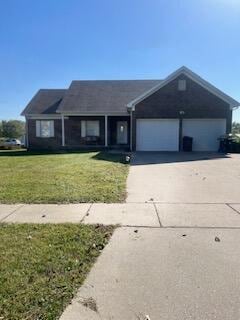 single story home with a front lawn and a garage