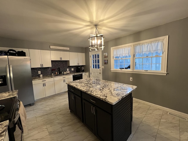 kitchen with visible vents, stainless steel appliances, marble finish floor, and a chandelier