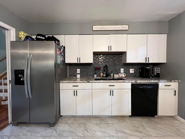 kitchen featuring sink, white cabinets, stainless steel refrigerator with ice dispenser, and black dishwasher