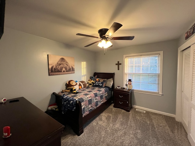 bedroom featuring ceiling fan, carpet floors, and a closet