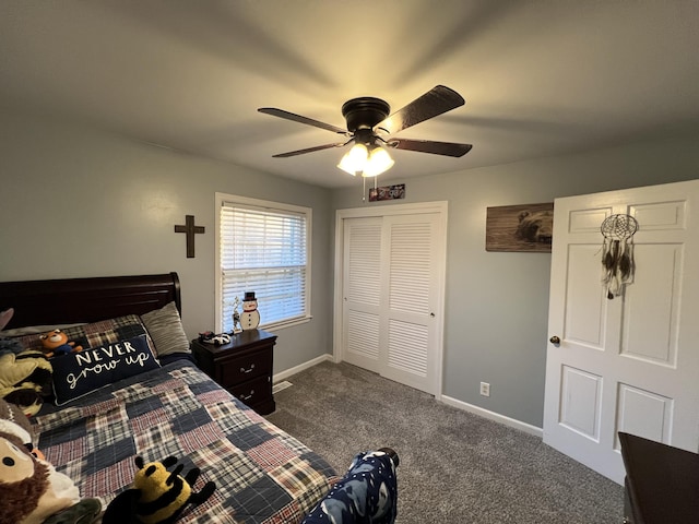 bedroom featuring dark colored carpet, a closet, baseboards, and ceiling fan