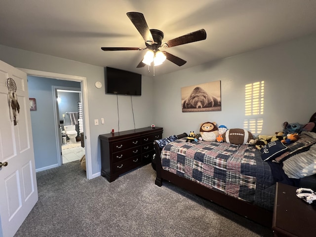 carpeted bedroom with ensuite bath and a ceiling fan