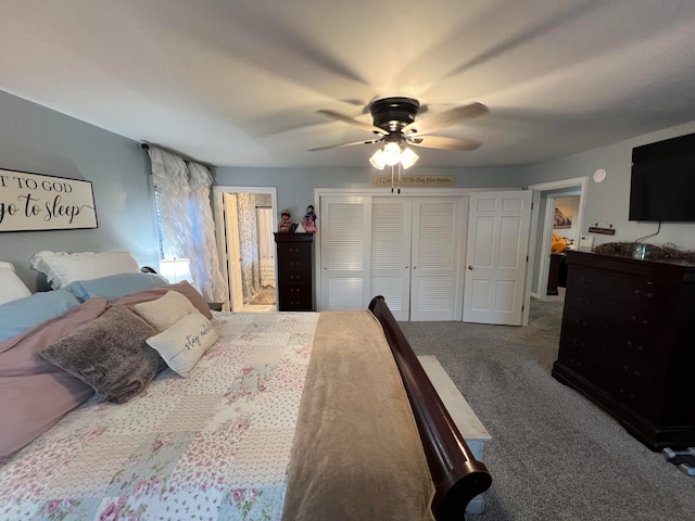 carpeted bedroom with ceiling fan and a closet