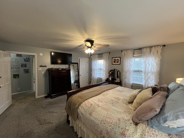 bedroom featuring baseboards, a ceiling fan, and carpet
