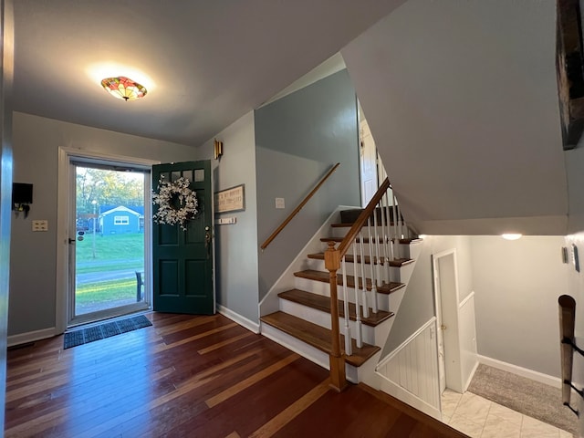 entryway featuring hardwood / wood-style floors and lofted ceiling