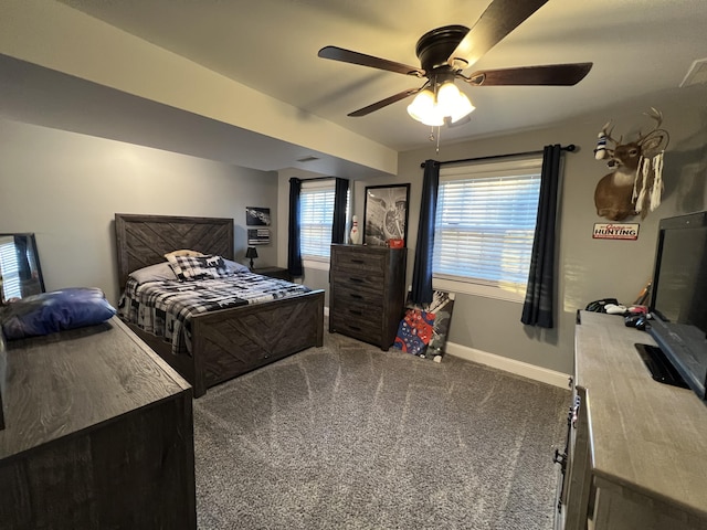 carpeted bedroom with baseboards and ceiling fan
