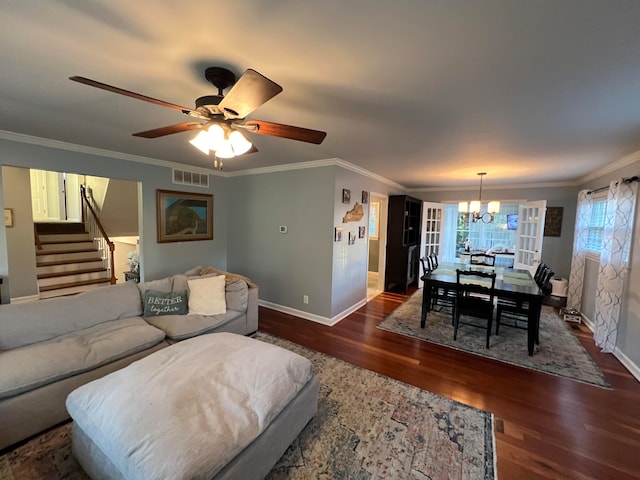 living room featuring crown molding, dark hardwood / wood-style flooring, and ceiling fan with notable chandelier