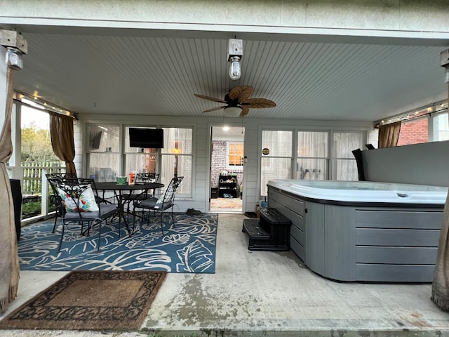 view of patio / terrace with a hot tub and ceiling fan