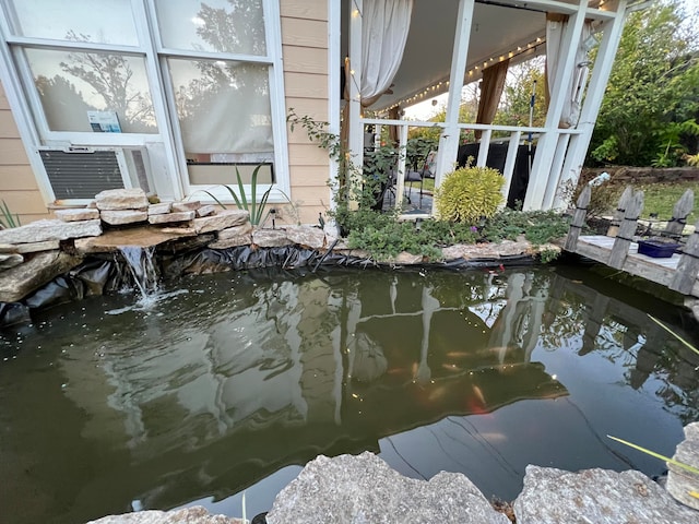 exterior space featuring a small pond