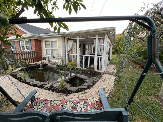 rear view of property featuring cooling unit