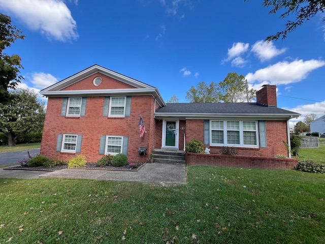 split level home featuring a front yard