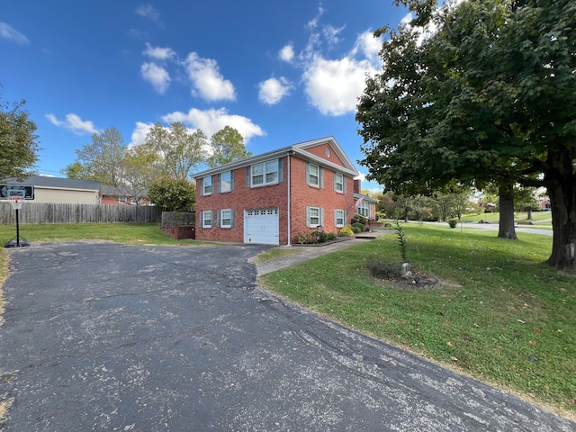 view of property exterior featuring a yard and a garage