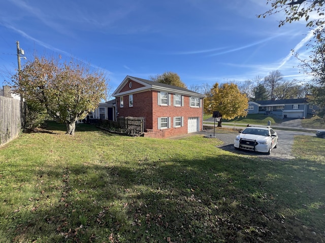 view of property exterior featuring a garage and a yard