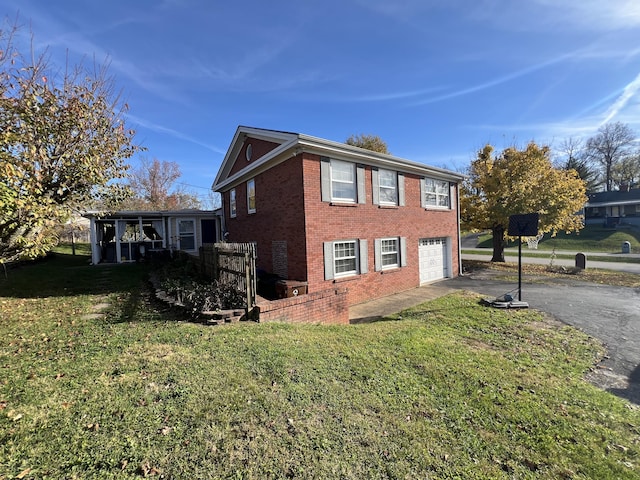 view of home's exterior with a lawn and a garage