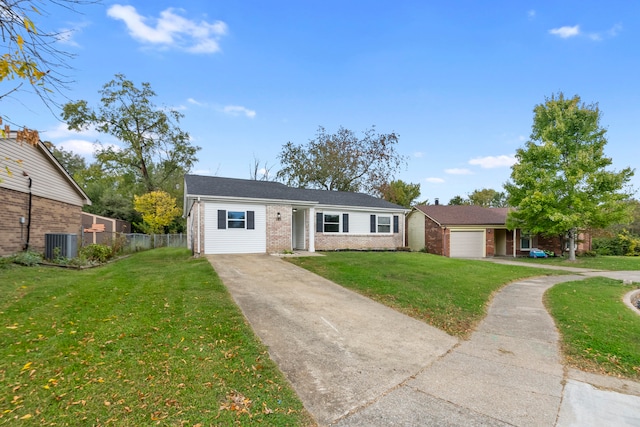 ranch-style house featuring a front yard, a garage, and cooling unit