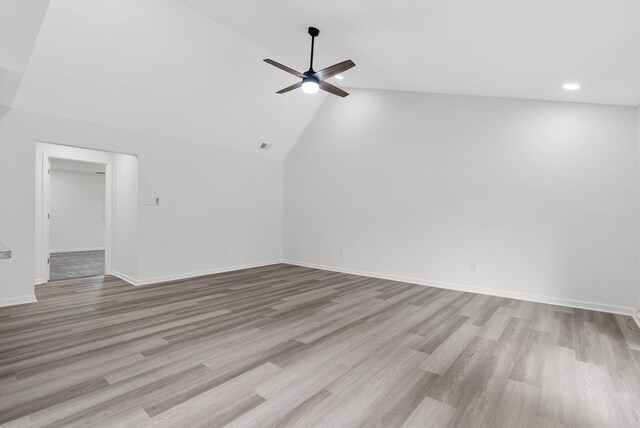 unfurnished living room with vaulted ceiling, light hardwood / wood-style flooring, and ceiling fan