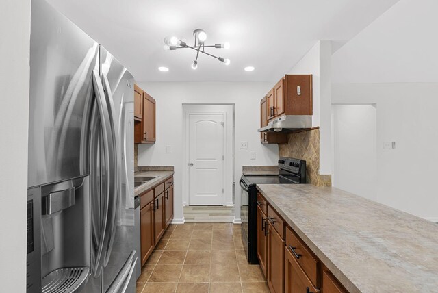 kitchen featuring an inviting chandelier, stainless steel refrigerator with ice dispenser, light tile patterned floors, and black electric range