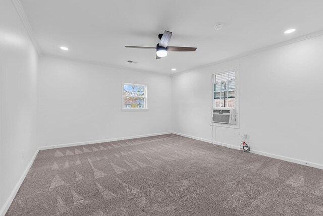 empty room featuring crown molding, carpet flooring, cooling unit, and ceiling fan