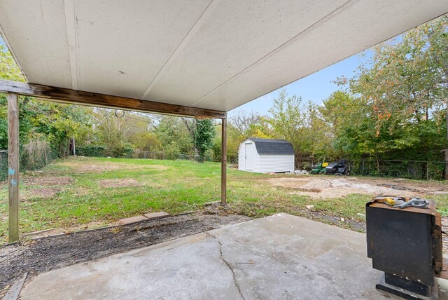 view of patio featuring a storage unit