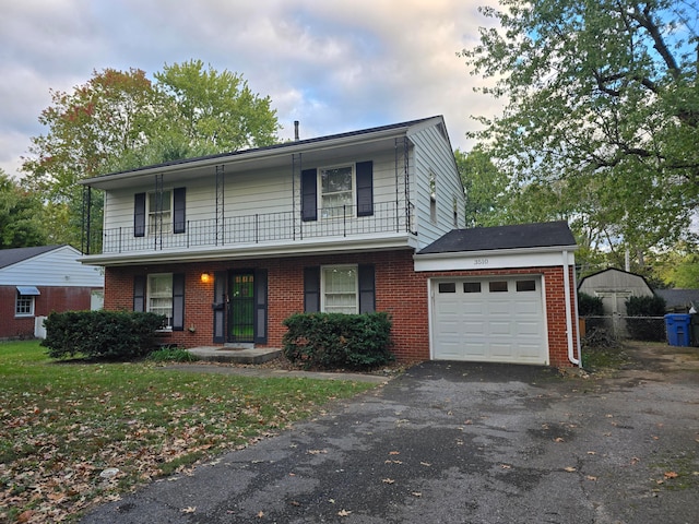 front of property featuring covered porch, a balcony, and a garage