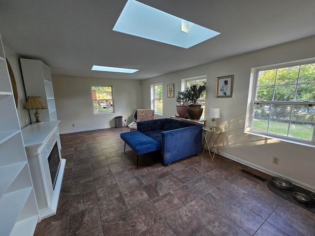 living room featuring a skylight