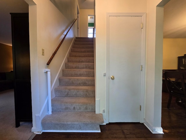 stairway featuring hardwood / wood-style flooring