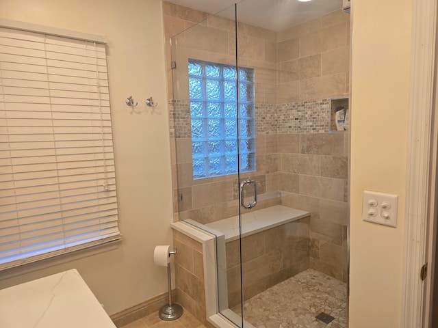 bathroom featuring an enclosed shower