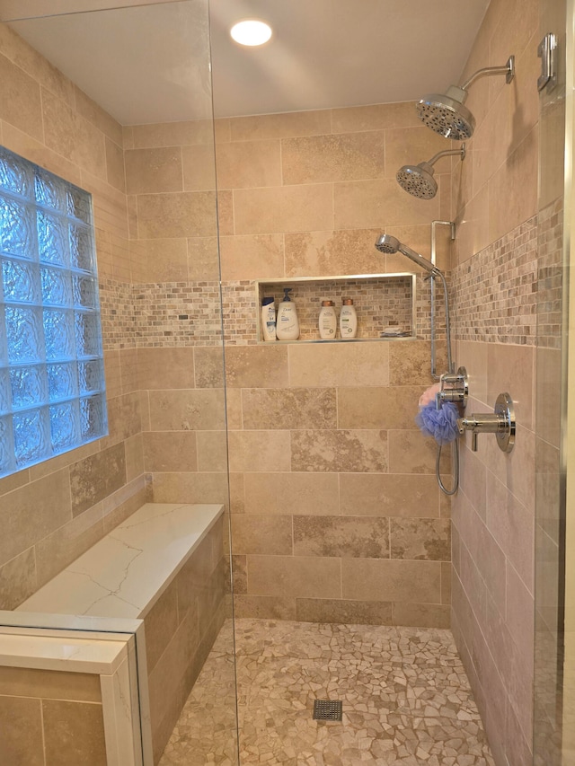 bathroom featuring a tile shower