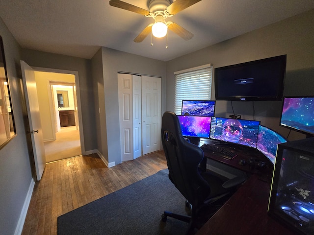 office featuring hardwood / wood-style flooring and ceiling fan