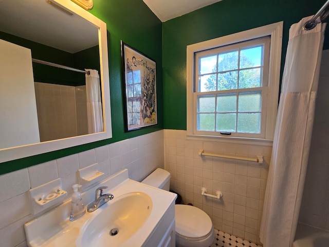 full bathroom with toilet, vanity, shower / bath combination with curtain, and tile walls