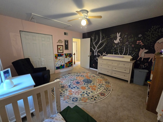 carpeted bedroom with a closet and ceiling fan