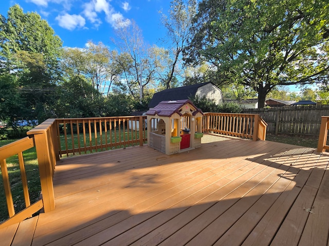 wooden deck with an outbuilding