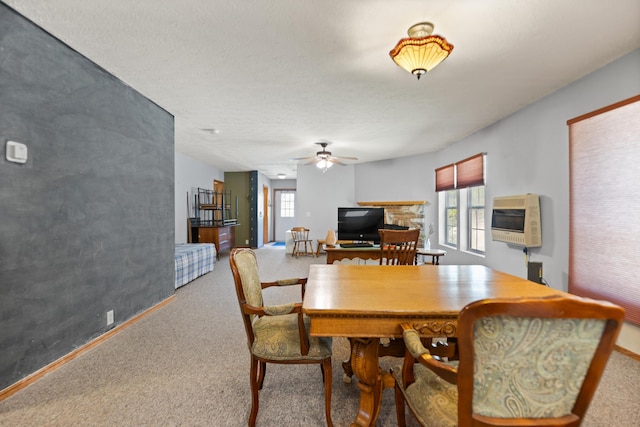 dining room featuring ceiling fan, a textured ceiling, carpet flooring, and heating unit