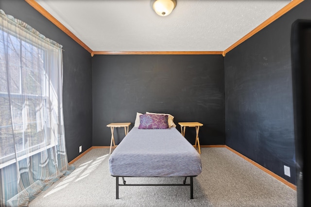 carpeted bedroom with crown molding and a textured ceiling